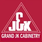 A red and white logo of grand jk cabinetry